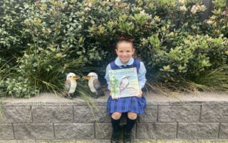 Chiara Castelvetere holds picture book Kookaburra