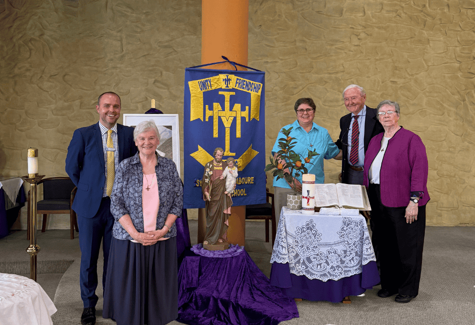 Photo showing Patrick Morrison, Principal of St Catherine Labouré Gymea with The Sisters of St Joseph of orange during their visit to his school