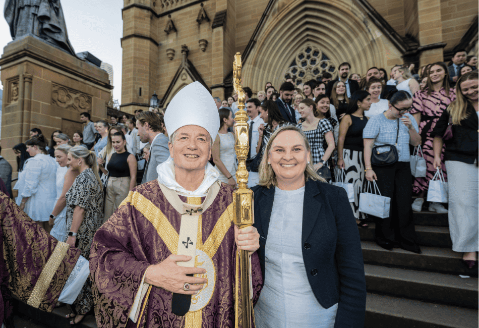 Photo showing Archbishop Anthony Fisher and Danielle Cronin, Executive Director of Sydney Catholic Schools on the steps of St Mary's Cathedral