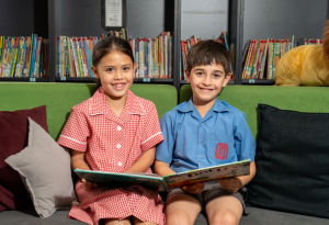A photo of two students from St Therese Catholic Primary School Miller reading