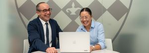 two teachers looking at a computer