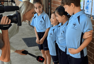 7News reporter Amy Clements speaks to St Kevin's Eastwood students about what kindness means to them